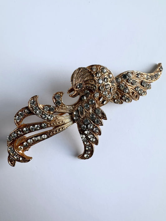 Goudkleurige vintage broche in de vorm van een Phoenix met gespreide vleugels