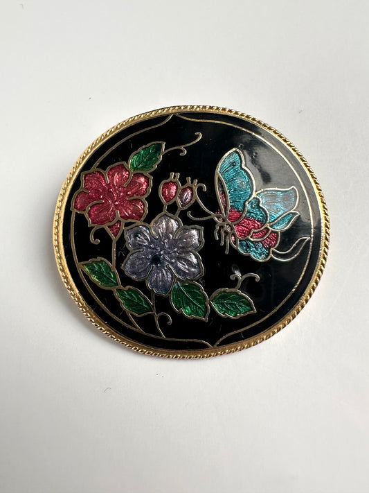 Vintage ronde broche goudkleurig in typische cloisonne stijl met bloemen 