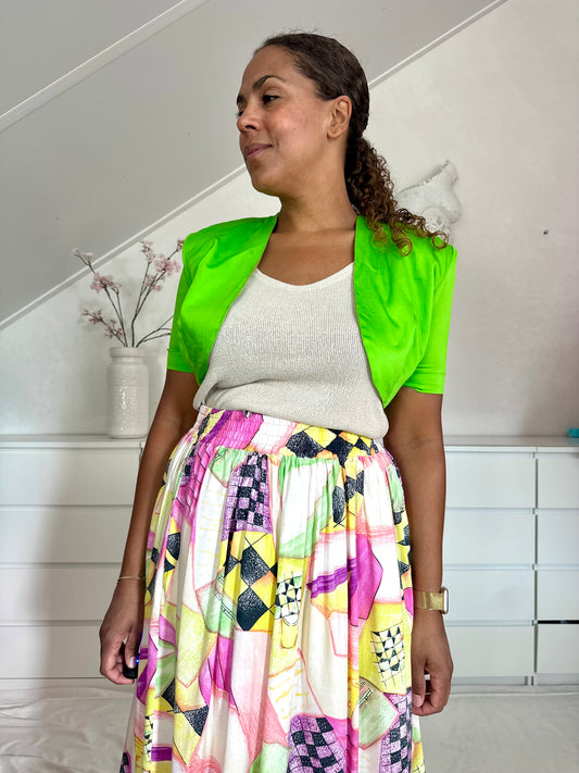 Vintage limegroene bolero met korte mouwen en open voorkant voor dames.