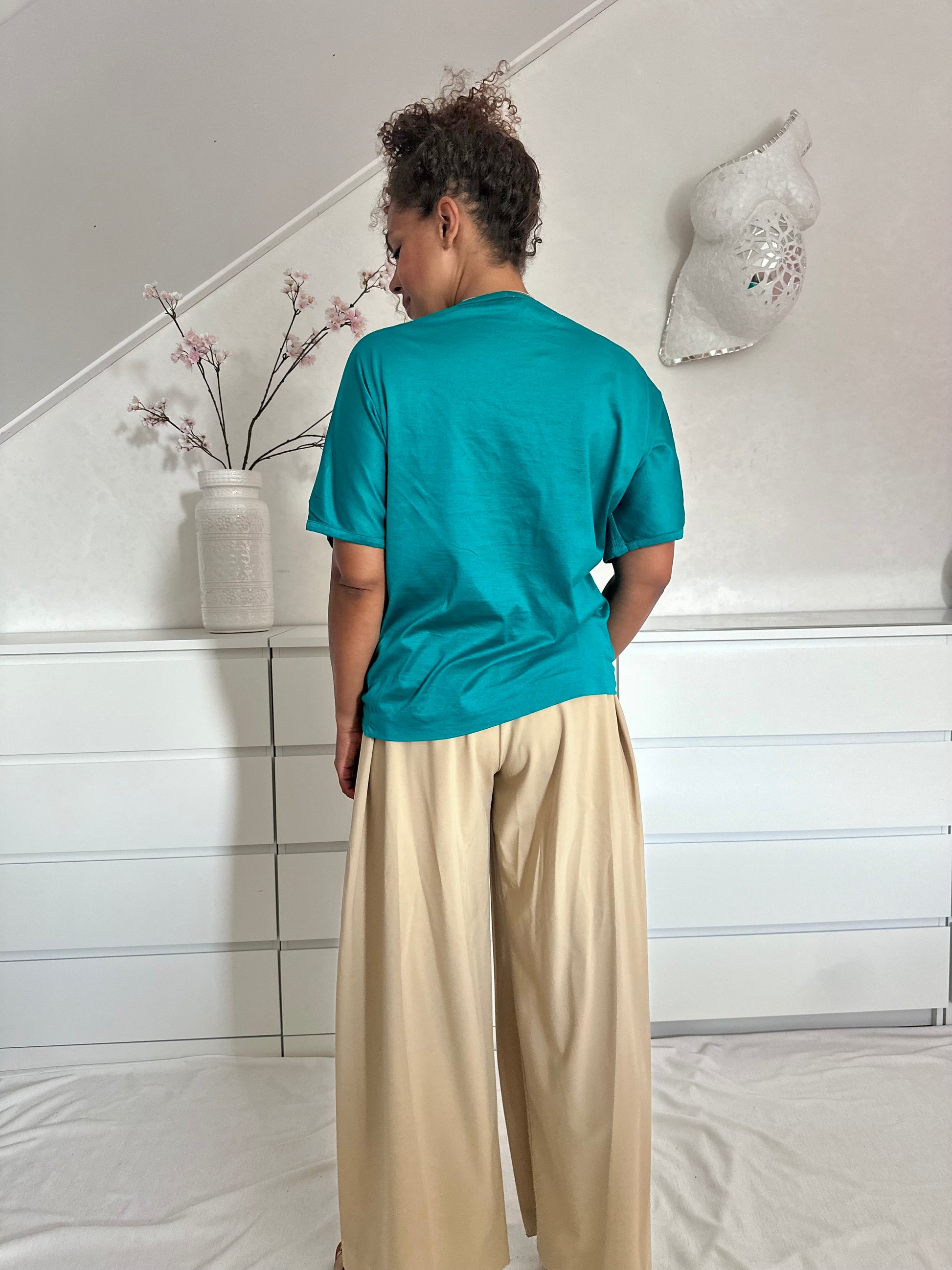 Achterkant van teal blauw shirt, vintage